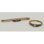 Two diamond set items comprising a Victorian 9ct bar brooch and an 18ct ring, size M/N, 3.9g