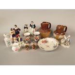 A collection of 19th century Staffordshire figures including a boy and girl scholar with