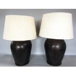 Pair of ovoid hammered copper table lamps, with shades, 55cm high with shades (2)