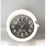 MkI Deck Clock US Navy bulkhead time piece dated 1942, the black dial with Arabic numerals and