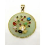 Eastern style 9ct circular jadeite pendant with applied gem set floral decoration