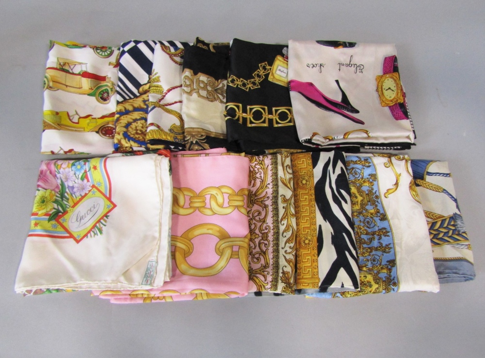 Eleven good quality silk scarves in various designs including a Gucci scarf of a winter scene 85 x