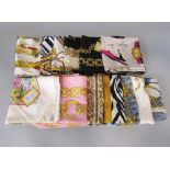 Eleven good quality silk scarves in various designs including a Gucci scarf of a winter scene 85 x