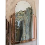 An art deco wall mirror with arched outline, framed within peach coloured glass border, 72cm max