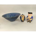 A Crown Devon blue ground vase and cover with polychrome and gilt enamelled style decoration with