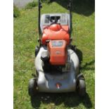 A Flymo Quicksilver 46S petrol driven rotary lawn mower with Briggs & Stratton engine