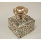 Good quality Art Nouveau continental white metal inkwell, the hinged lid over a bowl pierced with