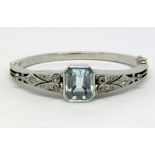 Impressive Art Deco style aquamarine and diamond hinged bangle, the octagonal step cut aquamarine