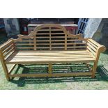 A Gloster contemporary teak three seat garden bench in the Lutyens style