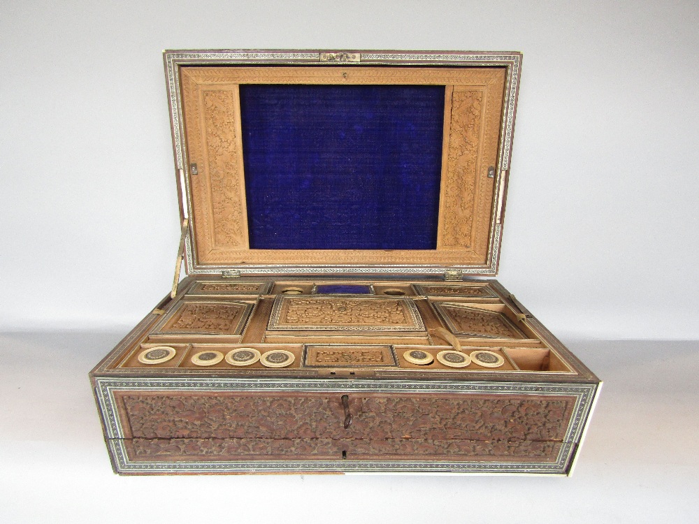 A 19th century sandalwood and inlaid sarcophagus shaped ladies work box with comprehensively