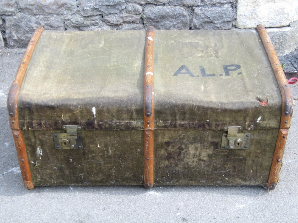 Two vintage travel trunks with canvas skins and timber lathes