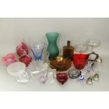 A large mixed collection of various cut and coloured glass to include decanters, art glass, etc (