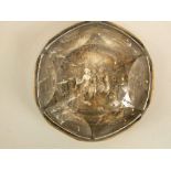 An unusual mid-19th century Pinchbeck glass paperweight with relief decoration of figures on horse