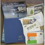 An album containing British stamps from QV onwards, three British post office mint stamp packs,