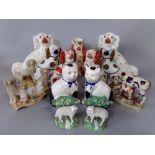 A collection of mainly 19th century Staffordshire animals including a pair of red and white