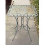 A contemporary light green painted cast aluminium three piece garden terrace set comprising a table,