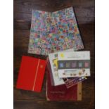 A stamp album and three stock books containing a quantity of British and Worldwide stamps,