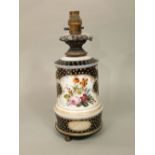 A 19th century blue ground ceramic oil lamp base with painted floral sprays and gilt spotted