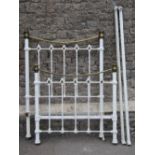 A Victorian brass and iron bedstead, with decorative finish, the upper brass rails of curved outline