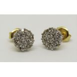 Pair of 18ct diamond daisy cluster stud earrings, 1.9g gross