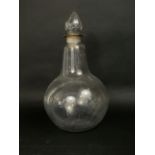 A large 19th century glass carboy with prismatic stopper, 47cm high (af)