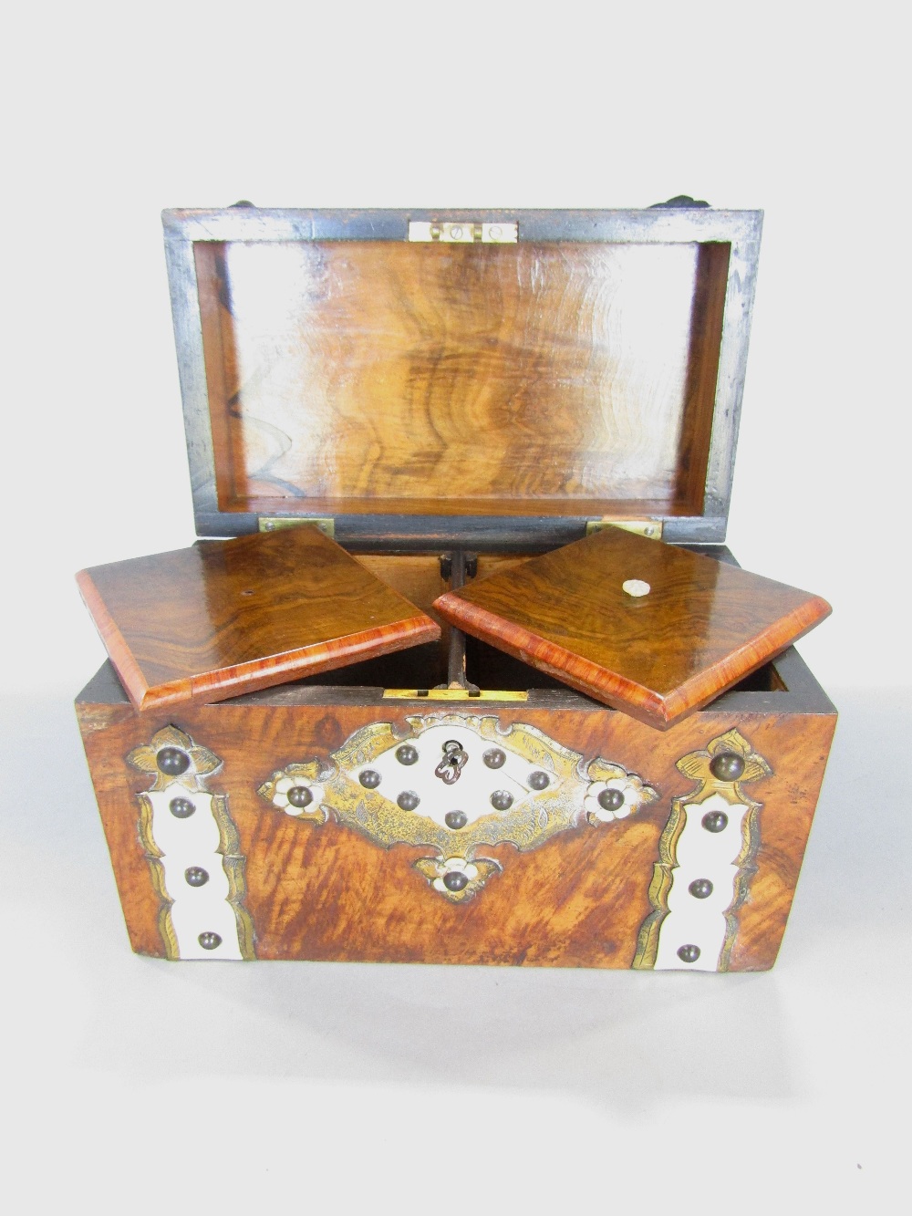 19th century burr walnut and strap work casket with stud and bone details, the hinged lid