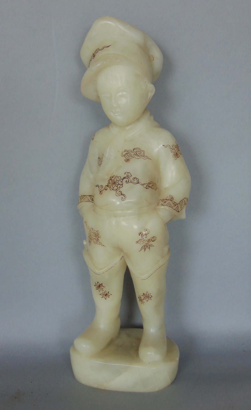 A Chinese cased soapstone study of a standing boy with shibayama type detail, the boy standing - Image 2 of 4