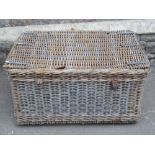 A substantial wicker laundry basket of some age