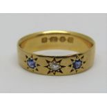 18ct blue spinel and diamond gypsy ring with star cut detail, size M, 3.5g