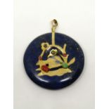 Eastern style 9ct circular lapis lazuli pendant with applied gem set decoration