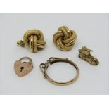 Group of 9ct items comprising a pair of large knot design stud earrings, novelty boot charm, heart