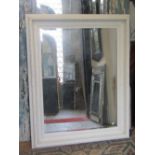 A large 19th century style wall mirror of rectangular form, the moulded frame with repeating