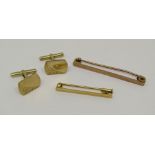 9ct pair of cufflinks with engraved decoration, together with two yellow metal tie pins; one with