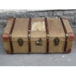 A vintage green canvas travelling trunk with timber lathes together with a vintage wicker work