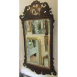 A 19th century Swansea type wall mirror with fretted outline, gilded hoho bird detail and