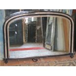 A Victorian arched overmantel mirror with ebonised and silver banded detail, 100cm wide x 70cm high