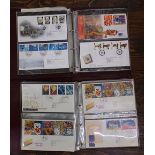 Two albums containing a quantity of Royal Mail First Day Covers including some with associated