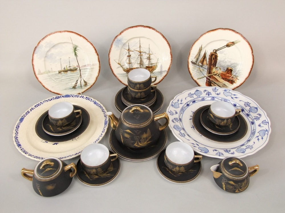 A collection of Japanese eggshell porcelain black ground tea wares with lithophane detail to base,