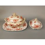 A 19th century two handled tureen and cover with brick red and gilt chinoiserie floral detail,