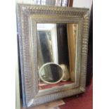 A large contemporary reproduction wall mirror of rectangular form with bevelled edge plate, within a