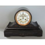 19th century black slate drum head mantel clock, the enamel chapter ring with Roman numerals over