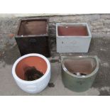 Four contemporary glazed planters of varying size and design, three impressed Heritage Garden
