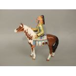 A Beswick model of a native American Indian on a brown and white pony, number 1391