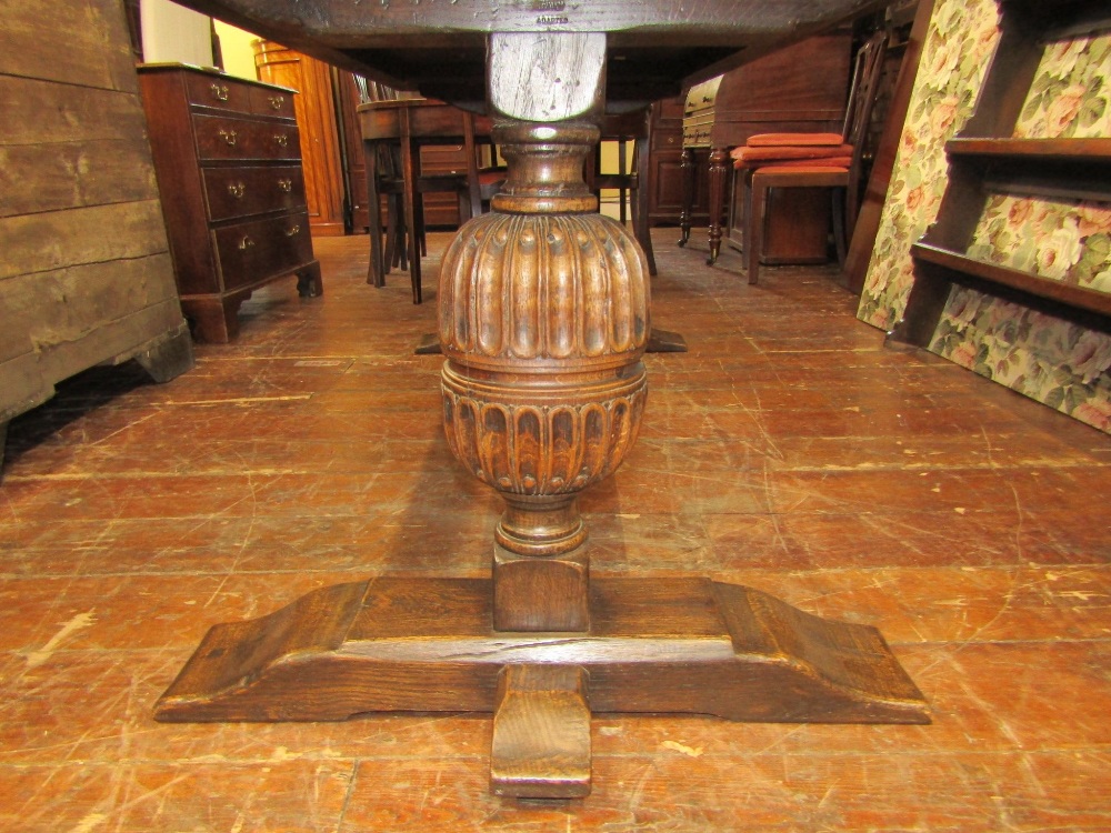 A 19th century oak refectory table, the plank top with carved borders, raised on a pair of - Image 3 of 3