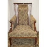 An inlaid Edwardian parlour chair with beige ground floral patterned upholstered seat, scrolled arms