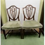 Six 19th century mahogany shield back dining chairs with floral and swag detail, upholstered