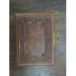 An Album Herborita photograph album with ornate embossed leather cover and brass clasp, together