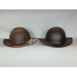 Pair of reproduction riveted cavalier helmets
