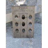A weathered oak champagne bottle rack/stand with folding easel back, printed lettering champagne,