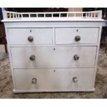 A Victorian pine bedroom chest of two long and two short drawers beneath a raised three quarter